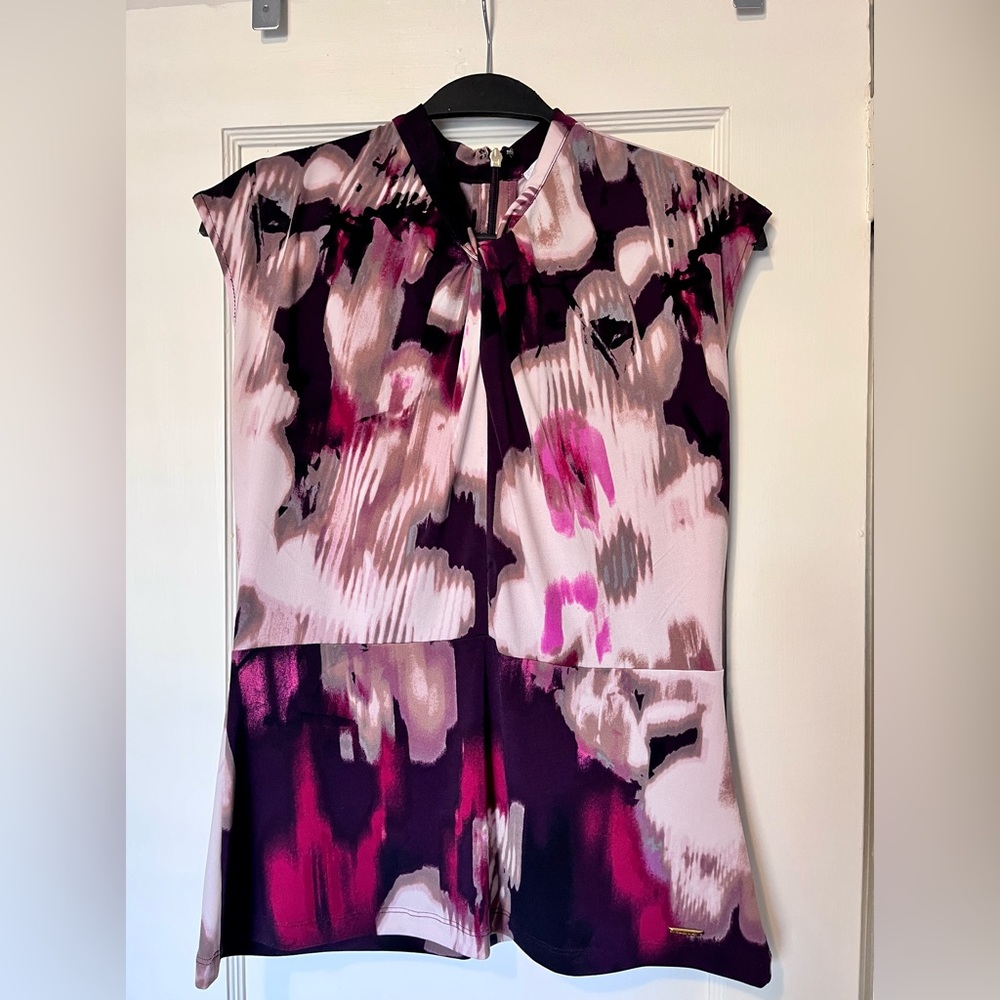 Calvin Klein blouse size M and silky feel. Beautiful on, EUC! Purple colors.